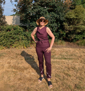 Wine-colored stretch trousers with embroidered angled hem detail